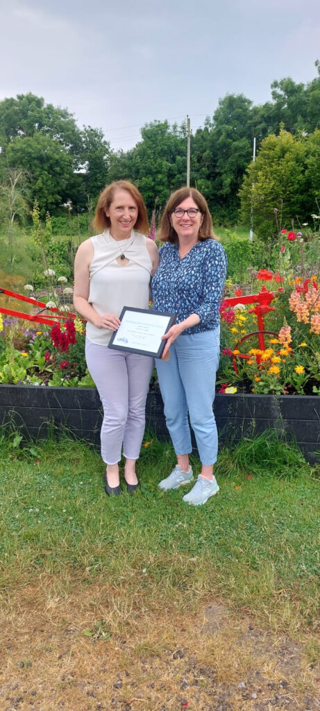 Gráinne Enright at Skerries Mills, receiving her award from Jane Landy (Chair of SCA)